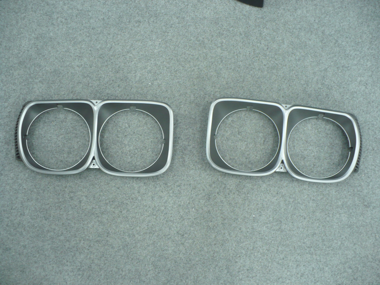 Mazda RX3 12A Charcoal Headlight Surrounds (Pair)