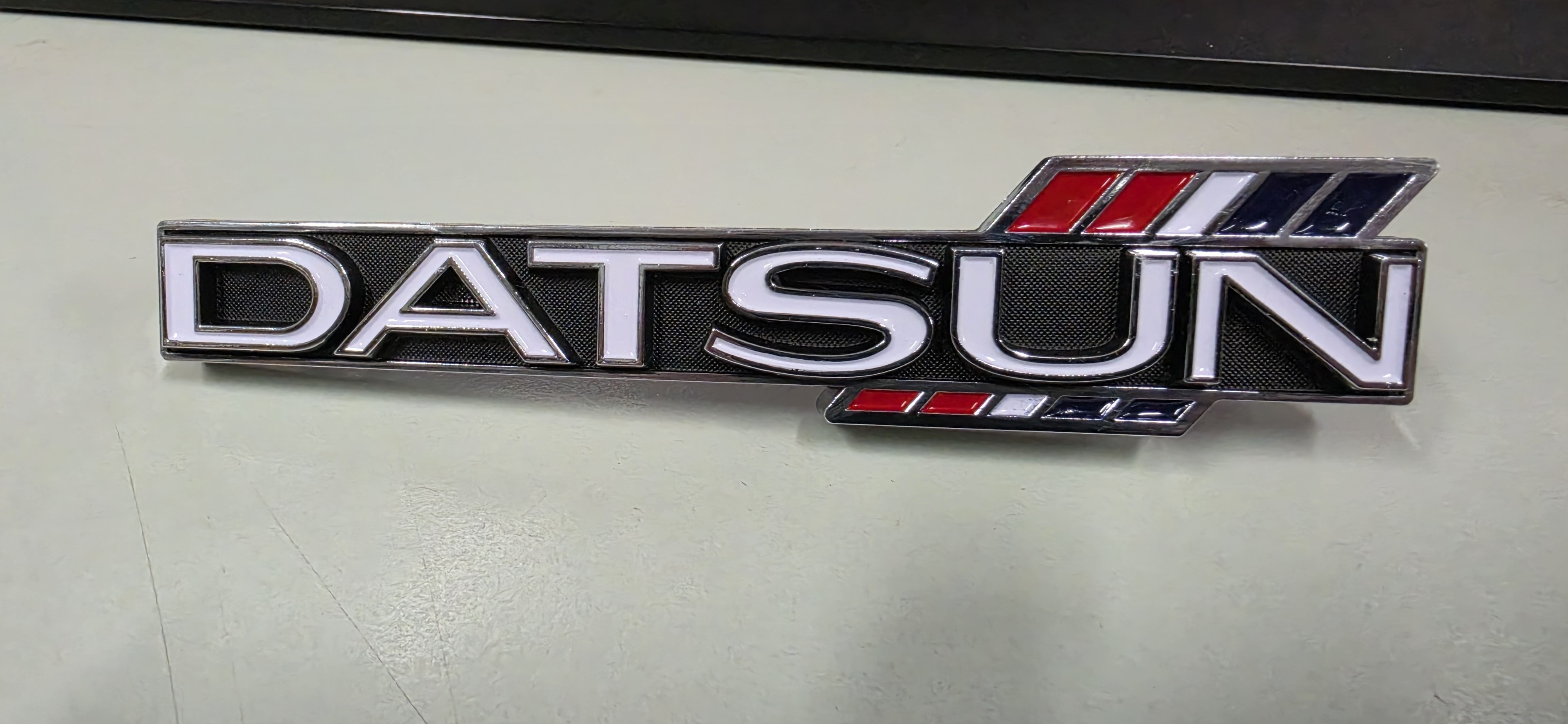 Datsun 1600 Grille Badge